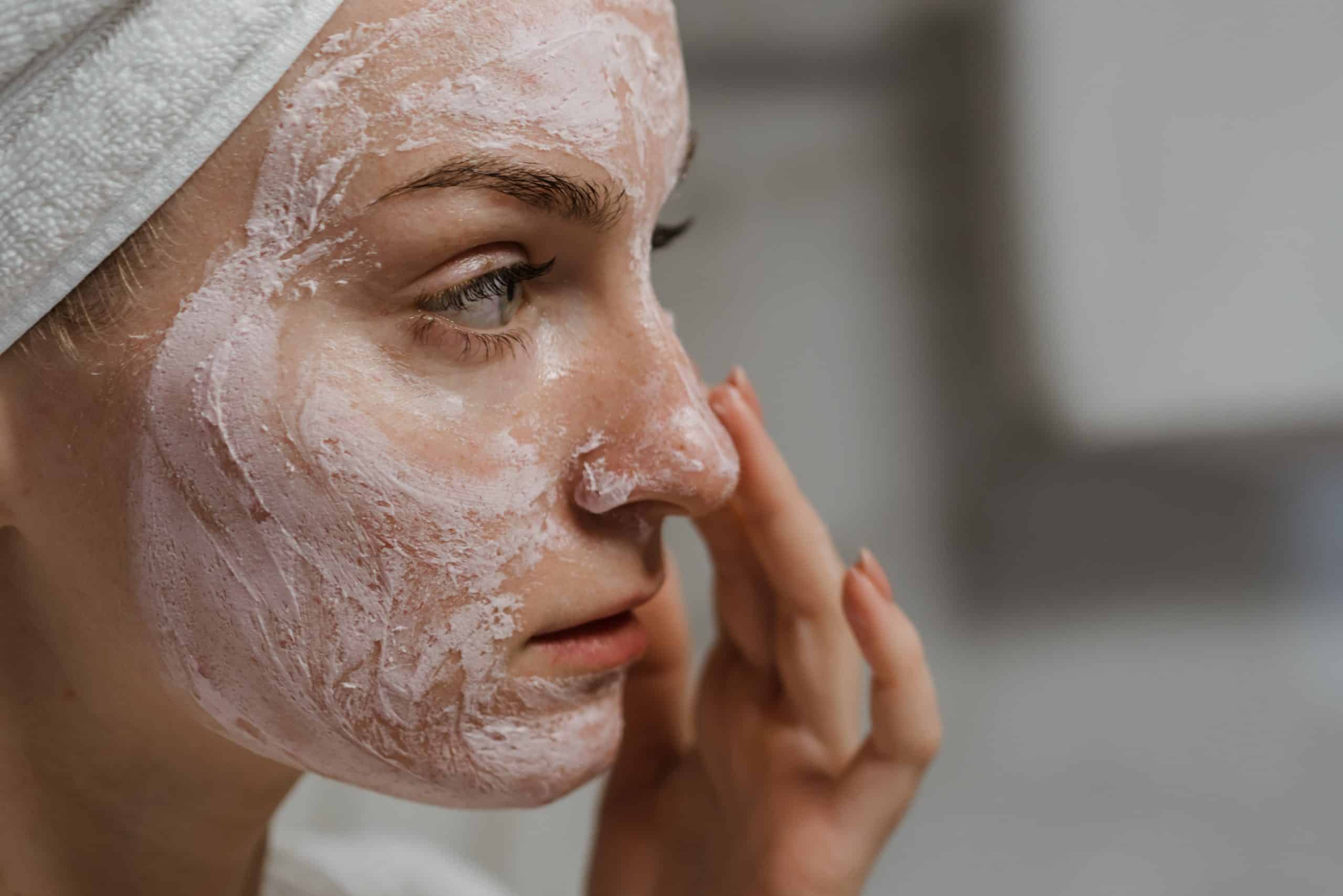 woman applying salicylic acid to her face